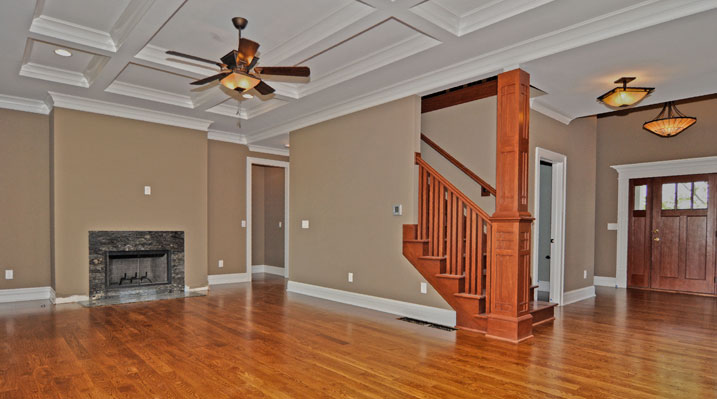 ICH Builders Mt. Sterling residence custom build showing main living area and fireplace with hardwood floors